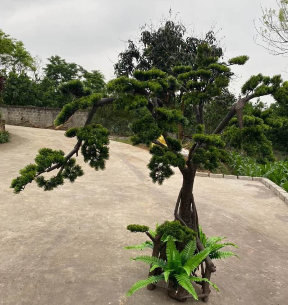 Cây Giả Trang Trí Không Gian – Xu Hướng Decor Xanh Hiện Đại 2 cây tùng giả